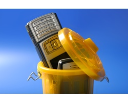 Mobil cell phone in the trash