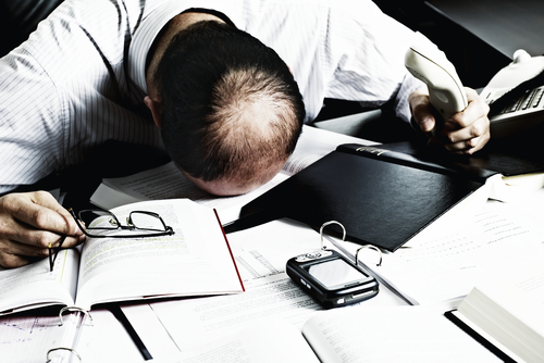 Employee Asleep on Desk