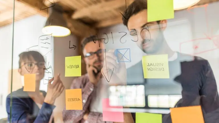team brainstorming with sticky notes
