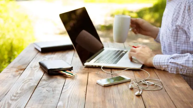 laptop and coffee on table