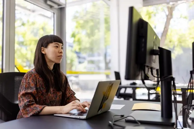 Woman working on laptop office