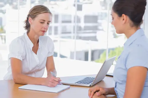 meeting with notepad and laptop