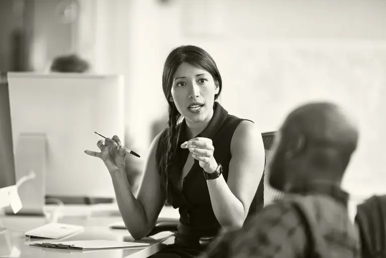 woman talking at desk