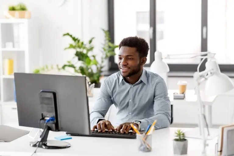 computer work desk with plants
