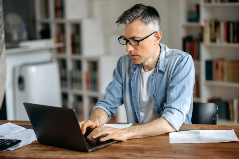 man working on laptop indoors