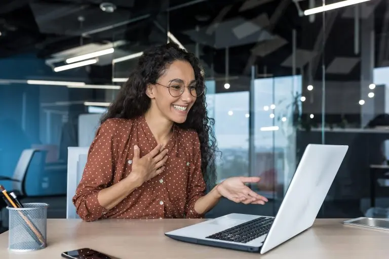 person video conferencing on laptop
