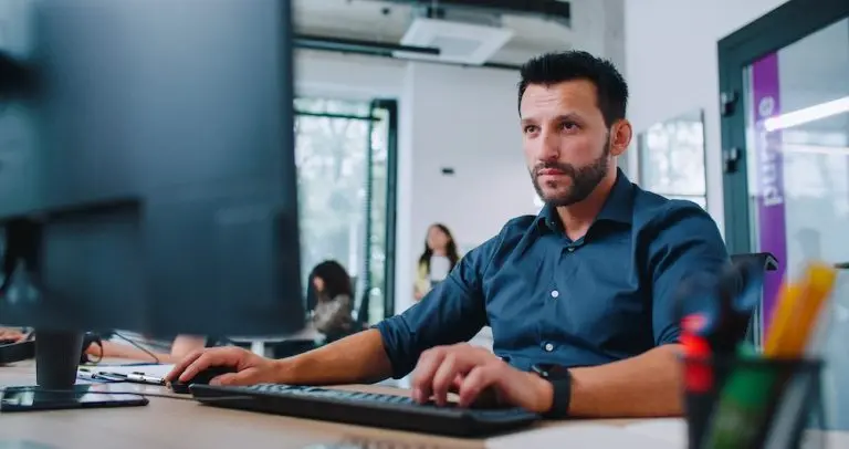 man working at computer