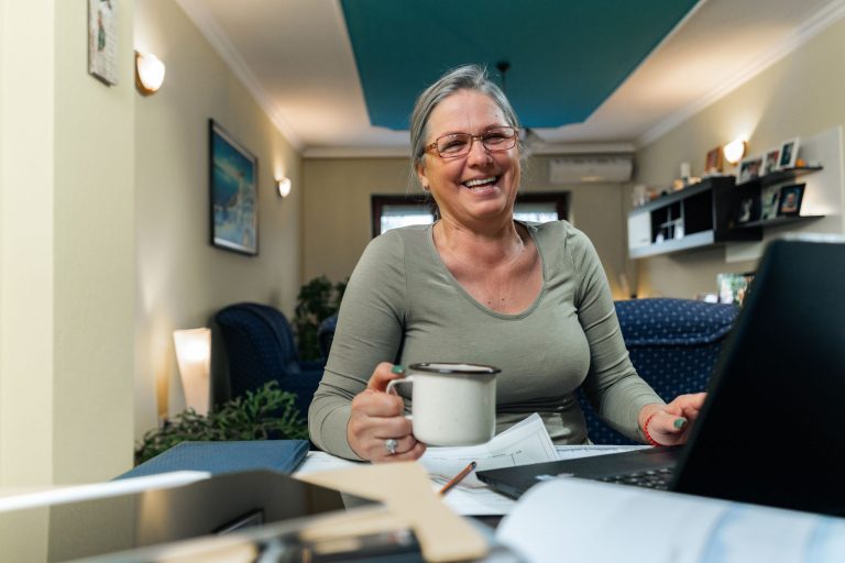 Smiling woman working at home
