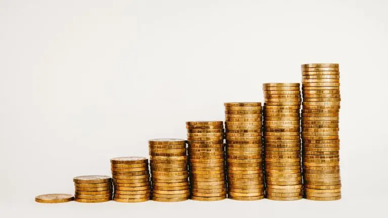 Stacked golden coins increasing growth