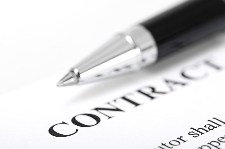 Pen on contract document closeup