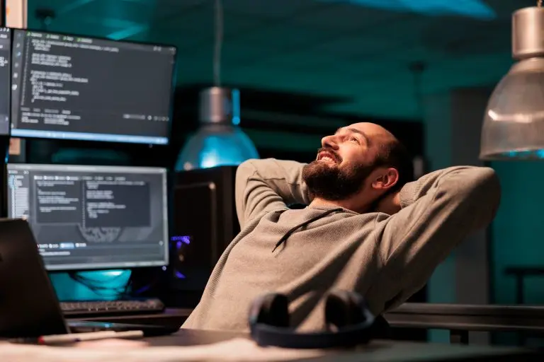 programmer relaxing at desk