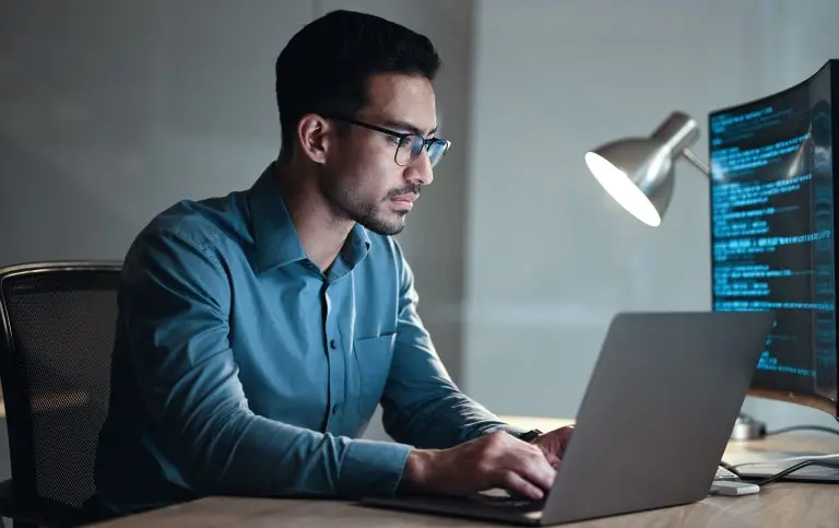 computer programmer working at desk