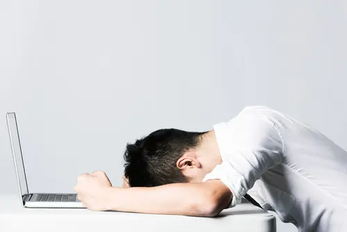 frustrated person at laptop