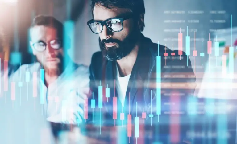 Men analyzing financial data overlay