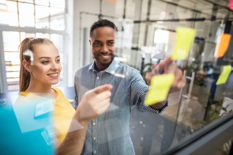 colleagues brainstorming with sticky notes
