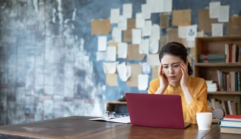 woman stressed at laptop
