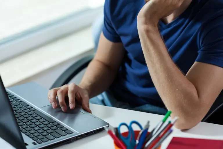 person using laptop at desk