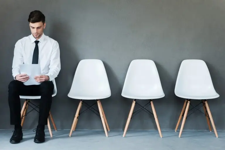 man sitting with paper