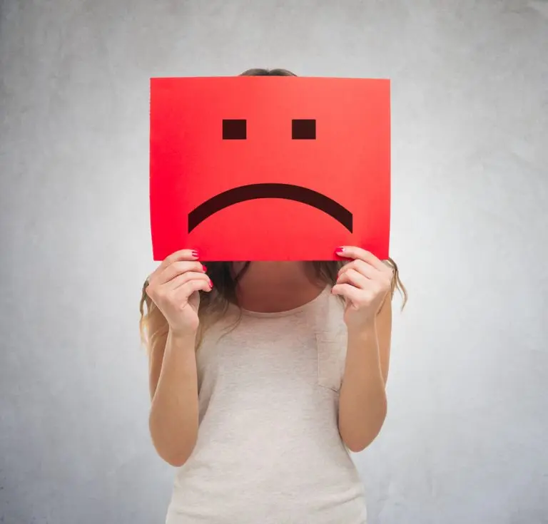 red sad face sign