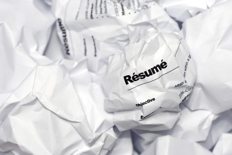 crumpled resumes papers