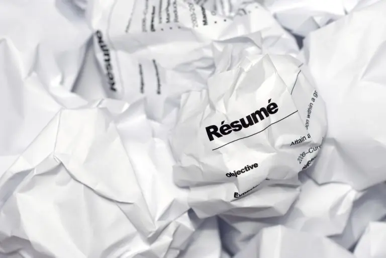 crumpled resumes papers