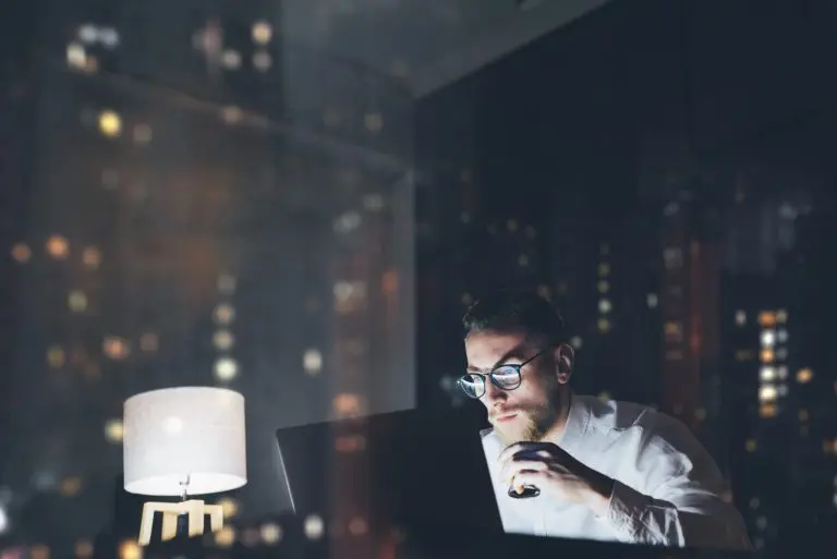 man working late at laptop