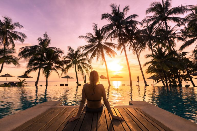 poolside sunset with palm trees