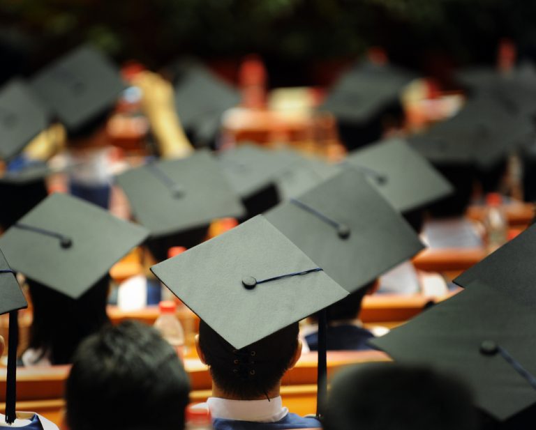 graduation caps in auditorium