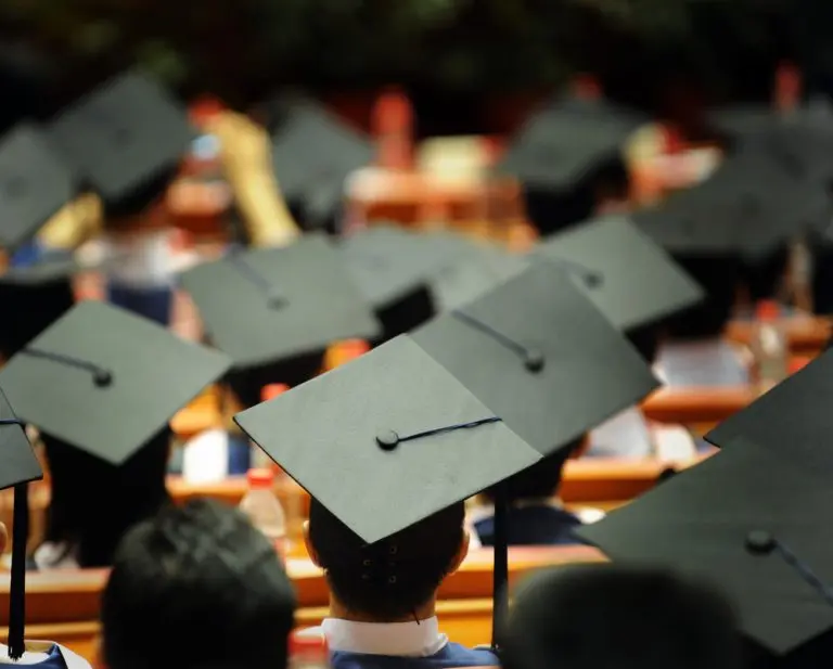 graduation caps in auditorium