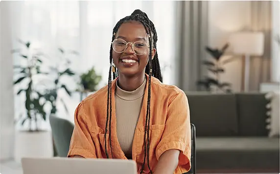 smiling woman working on the computer